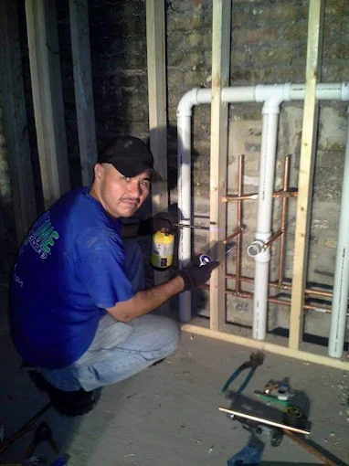 Eduardo Sandoval installing copper plumbing